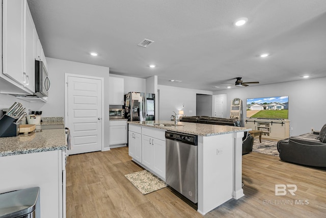 kitchen with ceiling fan, white cabinetry, light hardwood / wood-style flooring, and stainless steel appliances