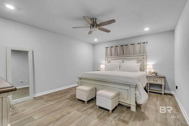 bedroom featuring ceiling fan and light hardwood / wood-style floors