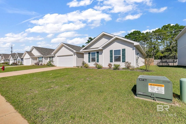 view of front of house with a front yard and a garage