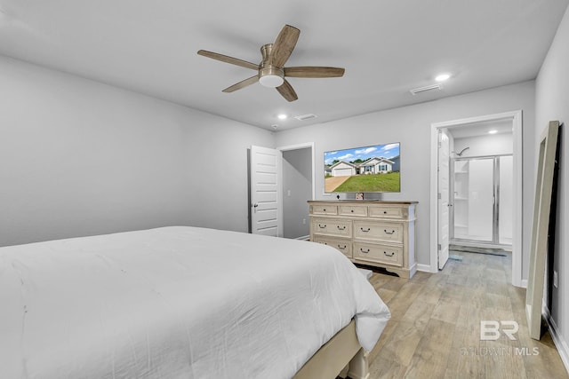 bedroom with light hardwood / wood-style floors, connected bathroom, and ceiling fan