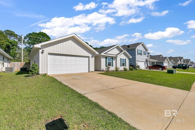 view of front of property with central air condition unit, a front lawn, and a garage