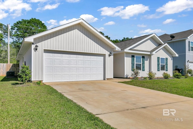 view of front of home featuring a front yard and a garage