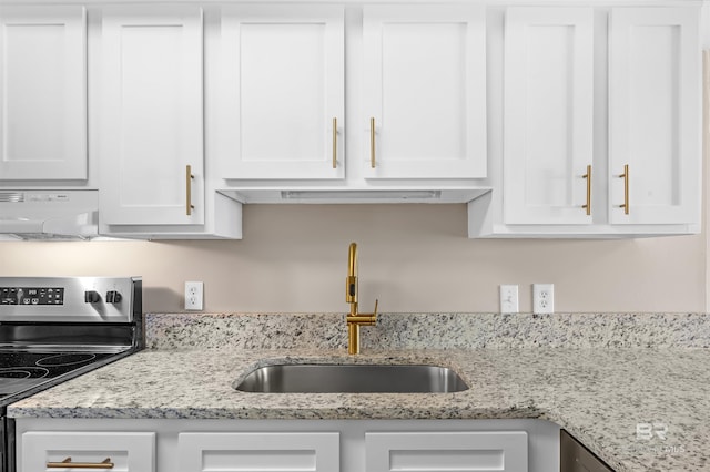 kitchen with a sink, extractor fan, stainless steel range with electric cooktop, white cabinetry, and light stone countertops