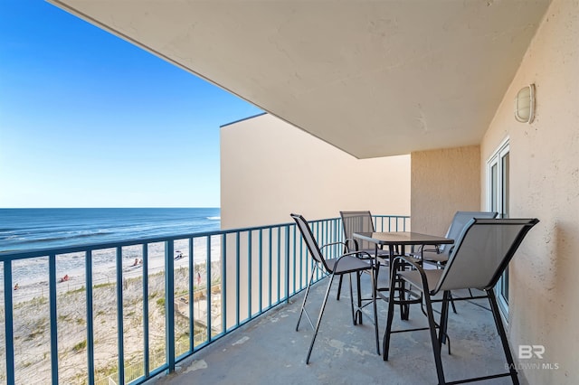 balcony with a view of the beach and a water view