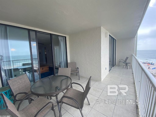 balcony with a view of the beach and a water view