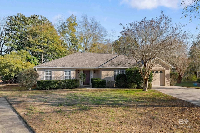 ranch-style home featuring a garage and a front lawn