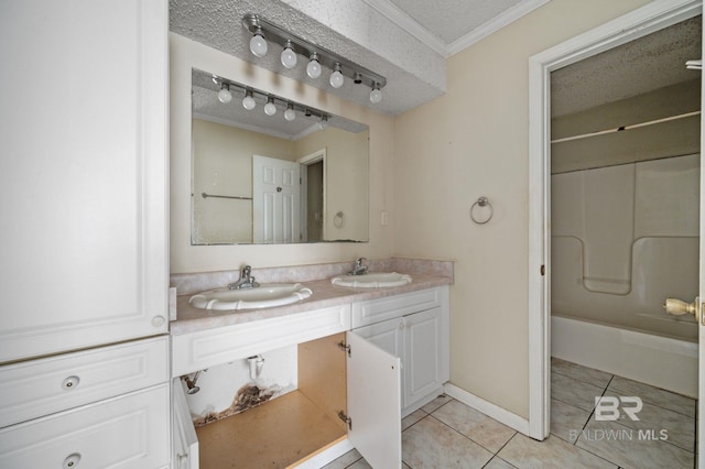 bathroom featuring tile patterned flooring, double sink vanity, a textured ceiling, shower / bathing tub combination, and ornamental molding