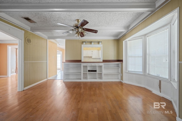 unfurnished living room featuring ceiling fan, a textured ceiling, and light hardwood / wood-style flooring