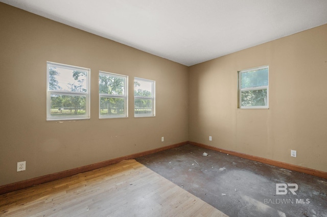 spare room with light wood-type flooring