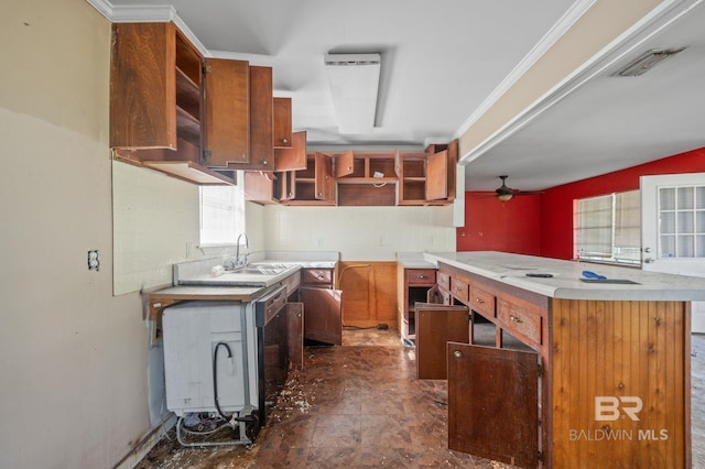 kitchen featuring dark tile patterned floors, sink, backsplash, crown molding, and ceiling fan