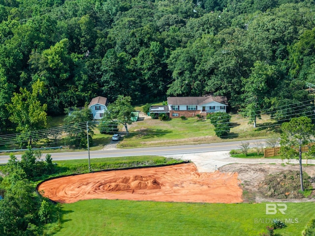 view of property's community featuring a lawn