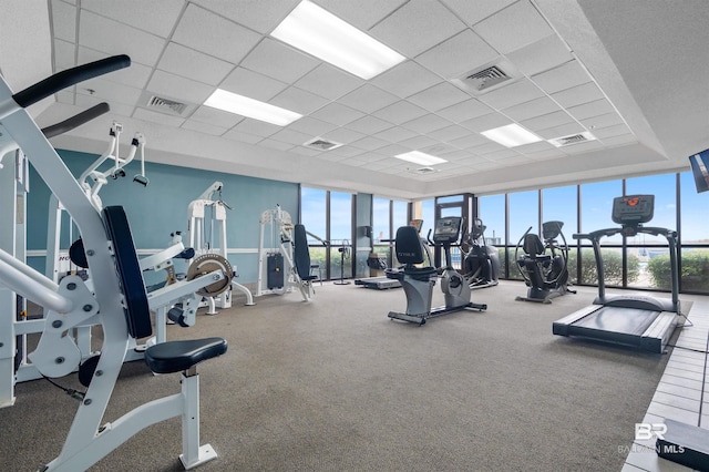 workout area featuring a drop ceiling and visible vents