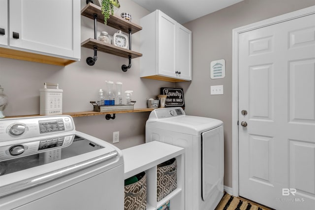25697 Overlook Dr, Loxley, AL 36551 - washroom featuring independent washer and dryer and cabinet space