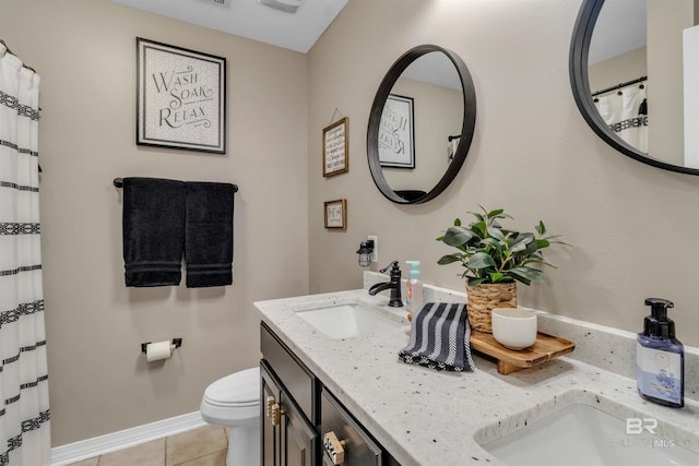 25697 Overlook Dr, Loxley, AL 36551 - full bath featuring tile patterned flooring, double vanity, toilet, and baseboards
