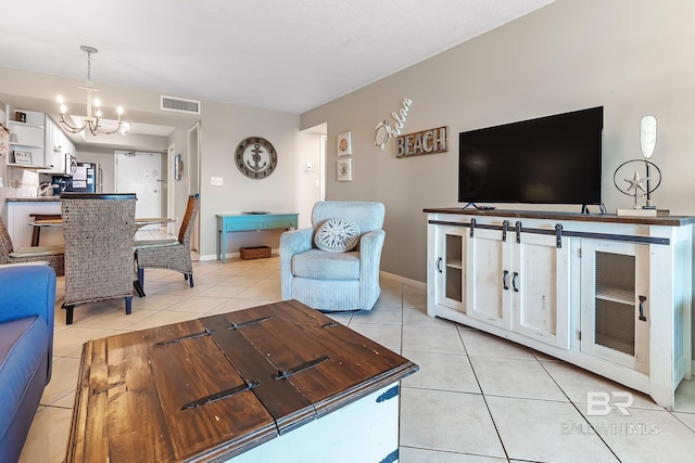 living room featuring a chandelier, visible vents, baseboards, and light tile patterned floors