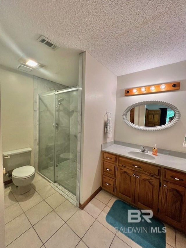 bathroom featuring a textured ceiling, visible vents, a stall shower, tile patterned floors, and toilet