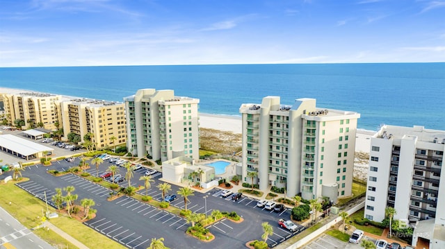 aerial view featuring a water view and a view of the beach