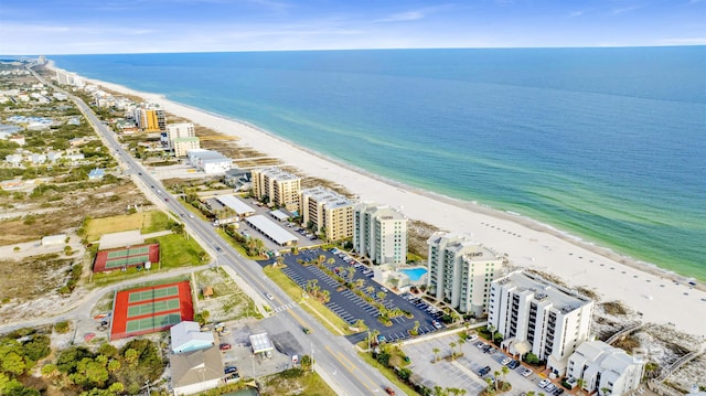 bird's eye view with a water view, a city view, and a view of the beach