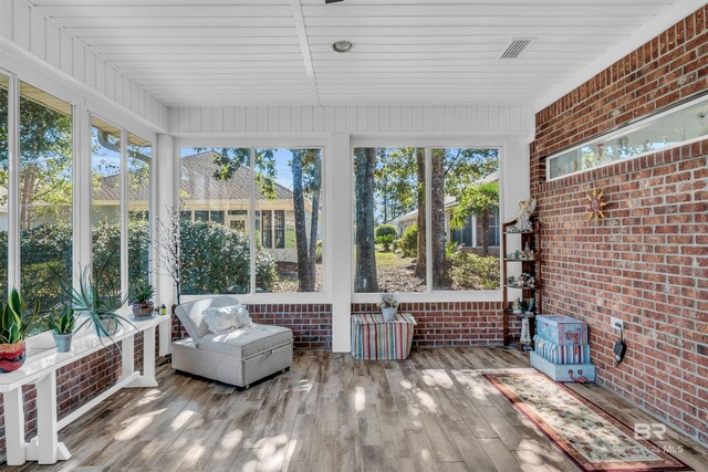 sunroom / solarium featuring a healthy amount of sunlight