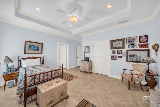 bedroom featuring a tray ceiling, ceiling fan, and crown molding