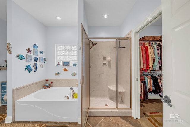 bathroom with tile patterned flooring and plus walk in shower