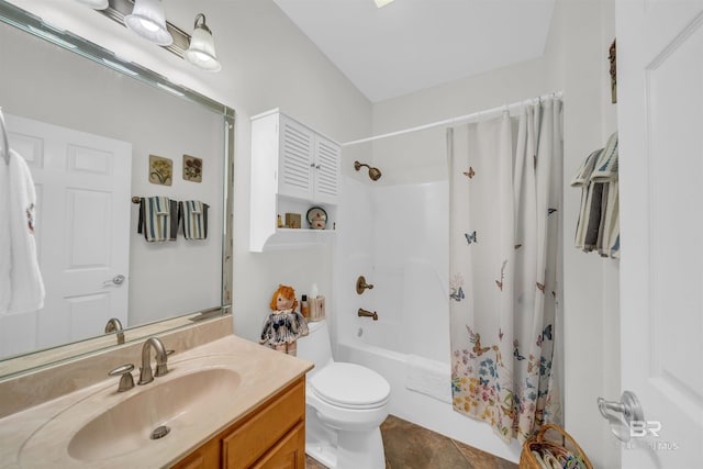 full bathroom with vanity, shower / bath combo, and toilet