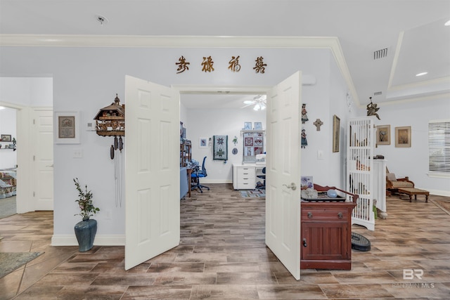 hall featuring hardwood / wood-style flooring and ornamental molding