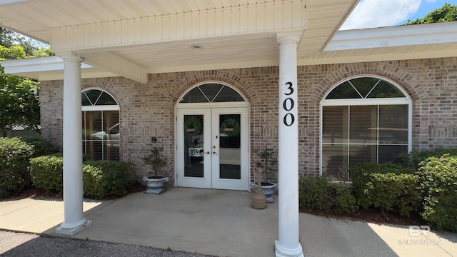 property entrance featuring french doors