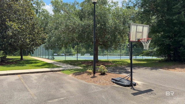 view of basketball court with tennis court