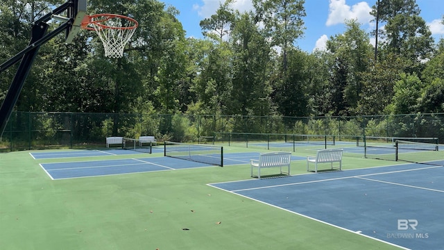 view of sport court featuring basketball hoop