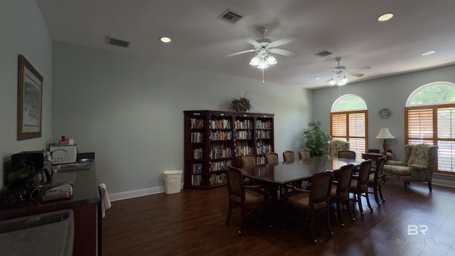 dining area featuring dark hardwood / wood-style flooring, ceiling fan, and sink