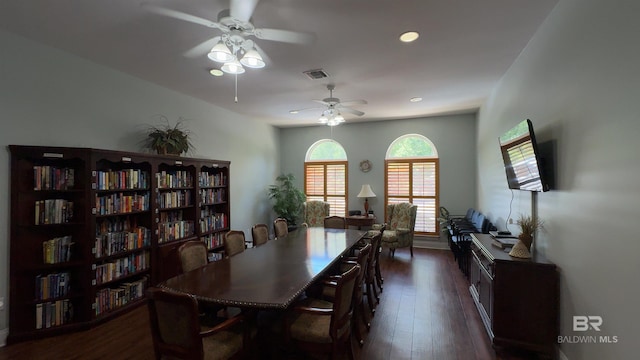 dining space with dark hardwood / wood-style flooring and ceiling fan