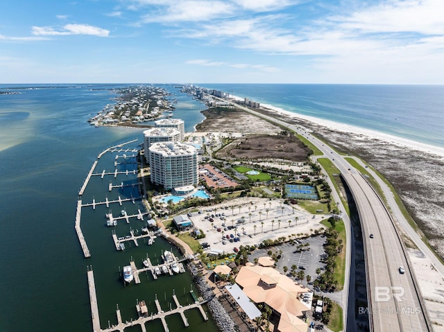 aerial view featuring a water view and a view of the beach