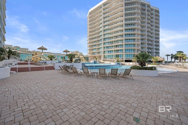 view of patio featuring a community pool