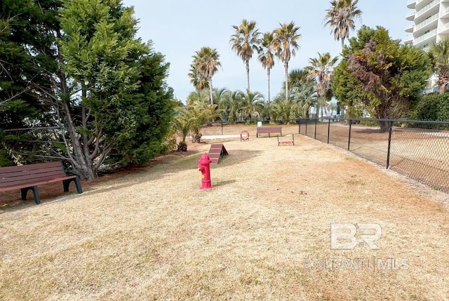 view of home's community with fence