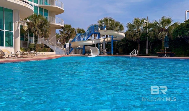 community pool with a water slide