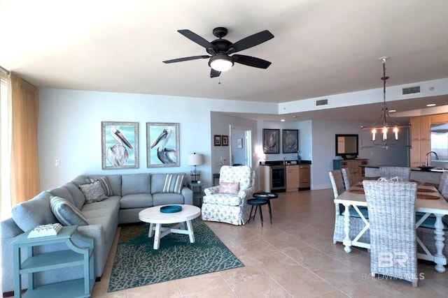 living room with a ceiling fan, wine cooler, visible vents, and light tile patterned floors