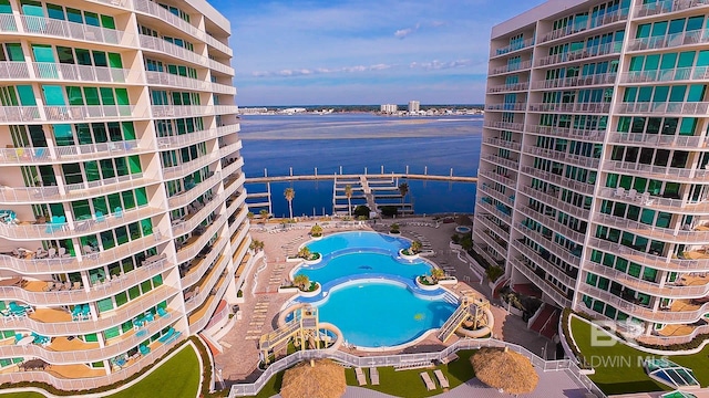 view of pool with a water view