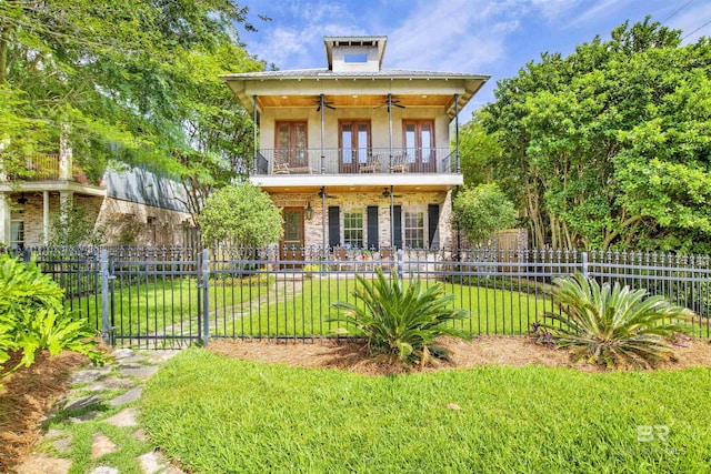 375 S Section St, Fairhope, AL 36532 - exterior space featuring stucco siding, a fenced front yard, a front lawn, and ceiling fan