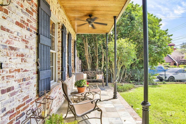 375 S Section St, Fairhope, AL 36532 - view of patio / terrace featuring ceiling fan, fence, and covered porch