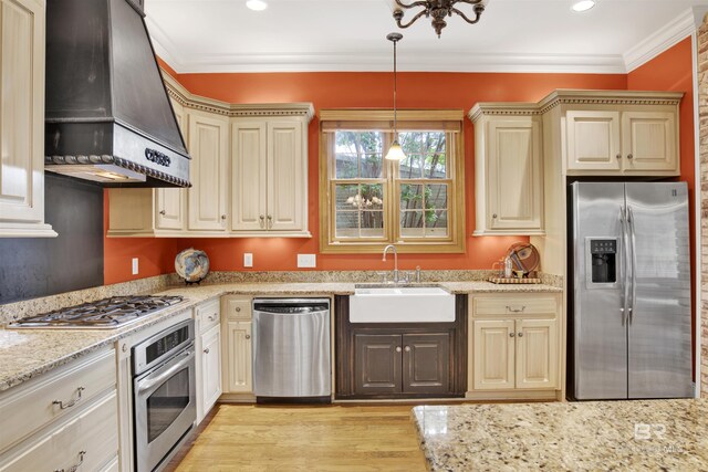 375 S Section St, Fairhope, AL 36532 - kitchen featuring a sink, light wood-type flooring, custom exhaust hood, appliances with stainless steel finishes, and ornamental molding