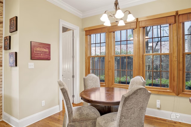 375 S Section St, Fairhope, AL 36532 - dining room featuring wood finished floors, a wealth of natural light, baseboards, and an inviting chandelier