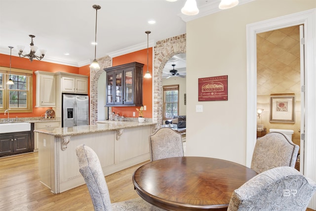375 S Section St, Fairhope, AL 36532 - dining area featuring recessed lighting, light wood-style floors, ceiling fan with notable chandelier, and ornamental molding