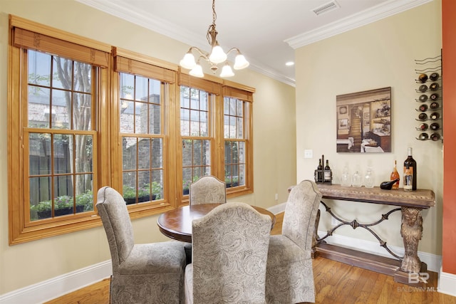 375 S Section St, Fairhope, AL 36532 - dining area featuring a wealth of natural light, baseboards, visible vents, and an inviting chandelier