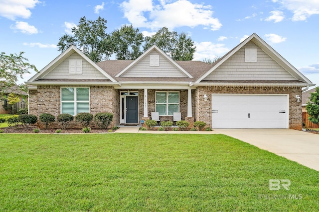 craftsman-style home featuring a front yard and a garage