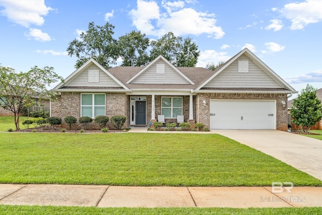 view of front facade featuring a front yard and a garage