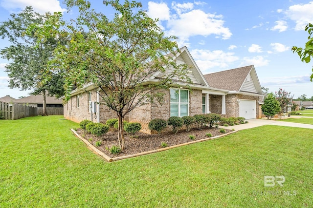 view of front of home with a garage and a front lawn