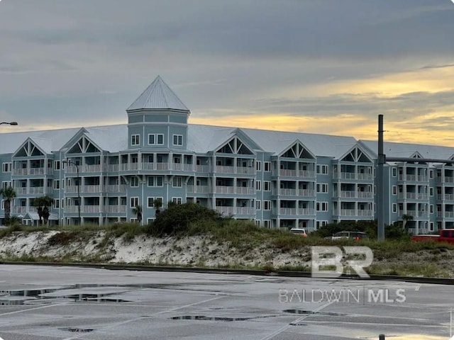 view of outdoor building at dusk