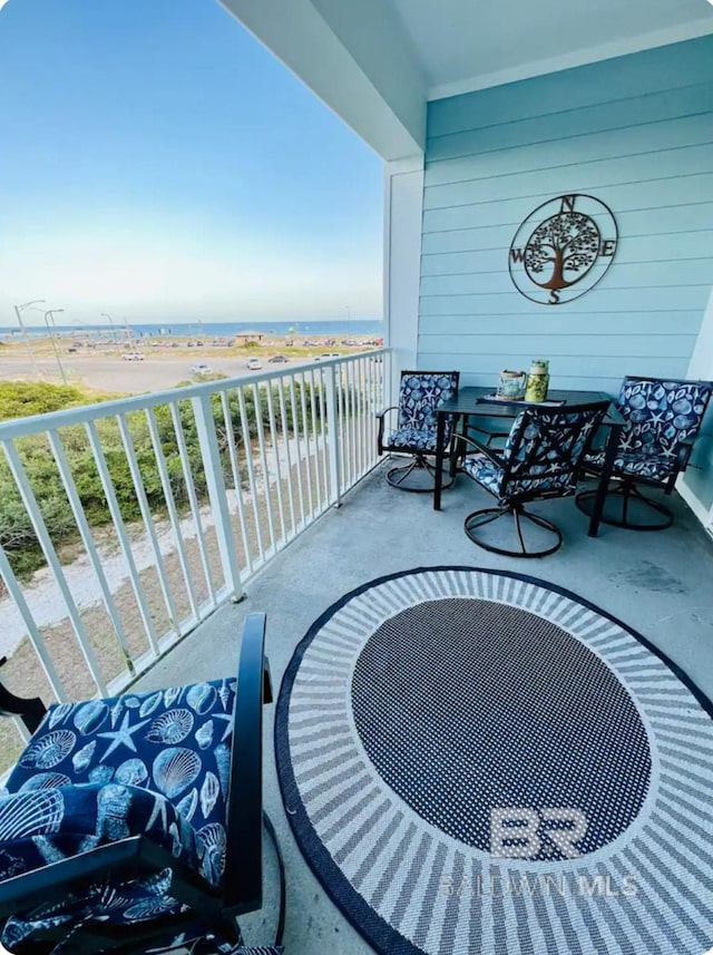 balcony featuring a water view