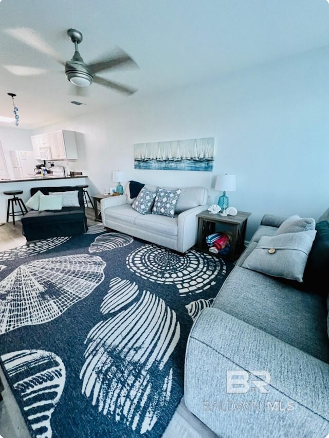 living room with ceiling fan